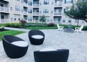 Thumbnail 21 of 26 - Community patio and lounge area at Highlands at Faxon Woods, Quincy