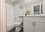 Thumbnail 5 of 23 - a bathroom with a sink toilet and a tub