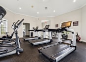 Thumbnail 15 of 23 - Free weights and fitness equipment in the 24 hour gym at Ballantrae Apartments