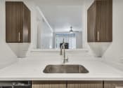 Thumbnail 17 of 31 - Deluxe Kitchen with Espresso Cabinetry at River Stone Ranch, Austin, TX