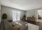 Thumbnail 3 of 23 - A living room with a grey couch and a coffee table.