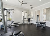 Thumbnail 18 of 23 - Free weights and fitness equipment in the 24 hour gym at Ballantrae Apartments