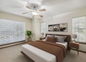 Thumbnail 8 of 23 - a bedroom with a bed and a ceiling fan