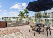 Thumbnail 17 of 31 - Grilling Area at Promenade at Reflection Lakes, Fort Myers, FL