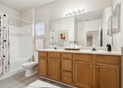 Thumbnail 8 of 31 - a bathroom with a sink and a toilet at Grandeville on Saxon, Orange City