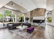 Thumbnail 23 of 27 - the clubhouse has a large stone fireplace and leather furniture