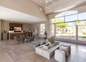 Thumbnail 25 of 27 - the living room of a clubhouse with a seating area and large windows at Altezza High Desert, Albuquerque, 87111