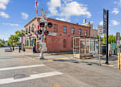 Thumbnail 33 of 34 - a red brick building on the corner of a city street at The Merc, Massachusetts
