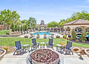 Thumbnail 15 of 27 - an outdoor patio with chairs and a pool at Altezza High Desert, New Mexico