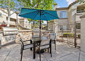 Thumbnail 22 of 27 - our patio has a table and chairs with an umbrella at Altezza High Desert, Albuquerque, New Mexico