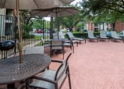 Thumbnail 27 of 31 - Poolside lounge area at Village Oaks Apartments, Austin, TX, 78759