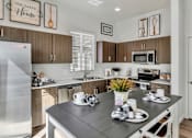 Thumbnail 2 of 43 - Kitchen with stainless steel appliances at Parke Place, Arizona