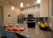 Thumbnail 12 of 27 - Kitchen with stainless steel appliances at Pima Canyon, Tucson
