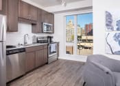 Thumbnail 13 of 40 - a kitchen with a view of the city and a window at Maven on Broadway, Minnesota, 55904