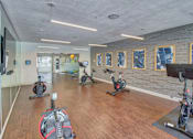Thumbnail 17 of 30 - Fitness Center with Peloton Bikes at Stonelake at the Arboretum, Texas, 78759