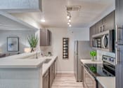 Thumbnail 7 of 30 - Kitchen at Stonelake at the Arboretum, Austin, Texas