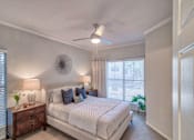 Thumbnail 12 of 30 - Bedroom With Study Table at Stonelake at the Arboretum, Texas, 78759