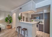 Thumbnail 11 of 30 - Kitchen with Quartz Countertops at Stonelake at the Arboretum, Texas, 78759