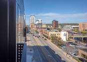 Thumbnail 34 of 40 - a view of the city from a window of a building at Maven on Broadway, Rochester, MN