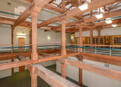 Thumbnail 22 of 33 - Exposed beams and brick wall accents at Bigelow Commons, Enfield