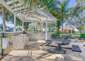 Thumbnail 35 of 46 - Patio with grill and picnic tables  at Cypress Legends, Fort Myers, 33905