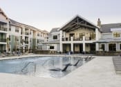 Thumbnail 19 of 37 - Pool with tanning ledge at Wharf 7 Apartments, Charleston