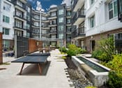 Thumbnail 18 of 24 - Outdoor patio with games  at Glenn Perimeter, Atlanta, GA