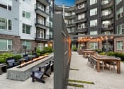 Thumbnail 17 of 24 - Outdoor dining area with fire pit at Glenn Perimeter, Atlanta, GA, 30328