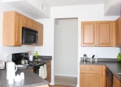 Thumbnail 17 of 46 - Updated Kitchen With Black Appliances| Cypress Legends at Cypress Legends, Fort Myers