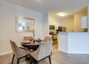 Thumbnail 3 of 14 - a dining room with a table and chairs next to a kitchen at Thornberry Apartments, Charlotte, NC