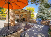 Thumbnail 20 of 22 - a patio with a table and chairs and an umbrella  at Altitude at Vizcaya, Santa Fe