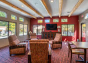 Thumbnail 12 of 34 - a living room with chairs and a table and a television at Vizcaya, Santa Fe, 87505
