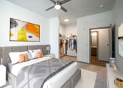 Thumbnail 7 of 22 - a bedroom with a bed and a closet at Altitude at Vizcaya, Santa Fe