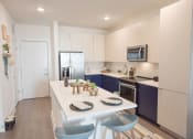 Thumbnail 12 of 28 - Chef-inspired kitchen with undermount sink, pull-down faucet, and plenty of pantry space at The Maven, Suwanee, GA, 30024