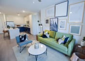 Thumbnail 22 of 28 - Open concept kitchen and living room at The Maven, Suwanee, GA, 30024