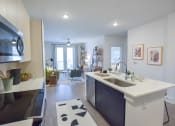 Thumbnail 19 of 28 - Kitchen with stainless steel appliances at The Maven, Georgia, 30024
