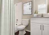 Thumbnail 7 of 14 - a bathroom with a shower and a toilet and a sink at Canyon Creek, Austin, Texas