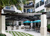 Thumbnail 18 of 35 - Outdoor patio with grills  | District at Rosemary at The District at Rosemary, Sarasota, FL