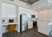 Thumbnail 6 of 27 - a kitchen with stainless steel appliances and desk at Element, Tampa, FL