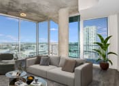 Thumbnail 7 of 27 - a living room with a large window and a couch in front of it at Element, Tampa, 33602