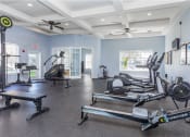 Thumbnail 31 of 46 - Fitness center with cardio machines at Cypress Legends, Fort Myers, FL