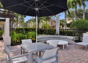 Thumbnail 17 of 38 - Poolside Patio and Lounge Area at Floresta, Jupiter