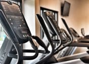 Thumbnail 10 of 12 - a row of cardio machines in a gym at 2300 West Apartments, Reno