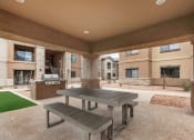 Thumbnail 50 of 50 - Outdoor covered patio with gas grill and picnic table at The Canyons at Linda Vista Trail, Arizona, 85704