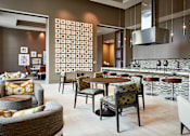 Thumbnail 29 of 39 - A modern dining room with a large table and chairs.