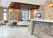 Thumbnail 37 of 39 - A reception area with a sign that says inspire.