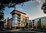 Thumbnail 39 of 39 - A modern apartment building with a mix of brick and panel facades.
