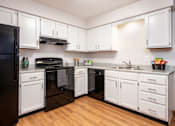 Thumbnail 1 of 22 - Kitchen with black appliance package | Preserve West at Preserve West, Wisconsin