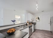 Thumbnail 8 of 26 - A kitchen with a bowl of fruit on the counter at Residences at Westborough Station, Westborough, MA