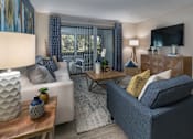 Thumbnail 35 of 43 - Living room with balcony access at Saddleworth Green, Ocala, FL